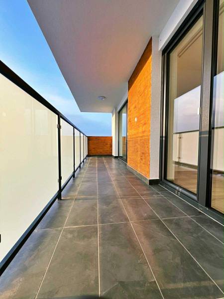 Safe balcony railing and dark tiles on the balcony of a 3-room apartment.