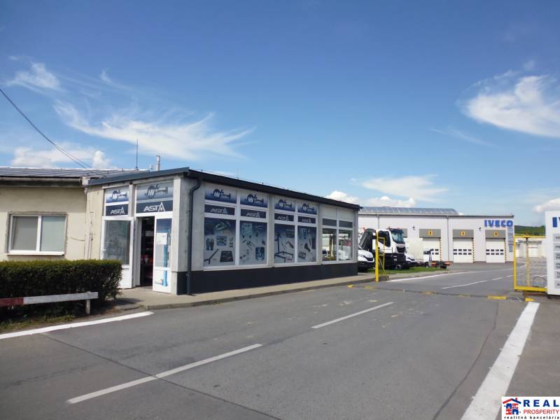 Building with garages and trucks on Strojnícka Street in Prešov, warehouses and halls.