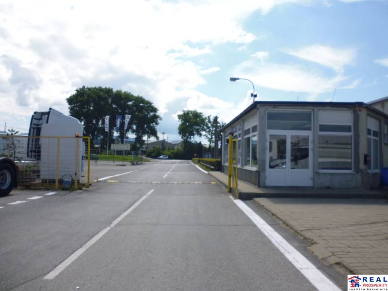 Entrance on Strojnícka Street in Prešov, leading to warehouses and halls.