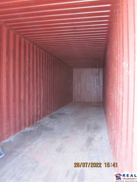 The interior of an empty storage container with a wooden decor floor in Warehouses and halls.