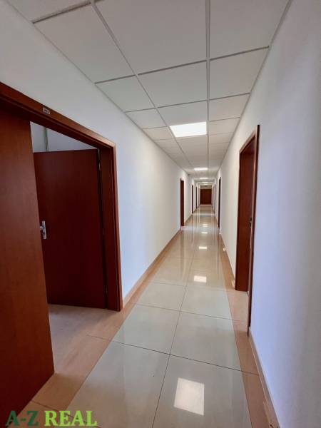 Offices with a long corridor and doors on both sides.