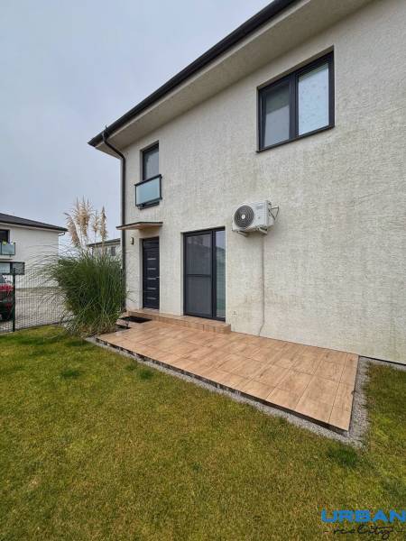 A 3-room apartment on Kráľovianky has a terrace and a grassy area with a gray facade.
