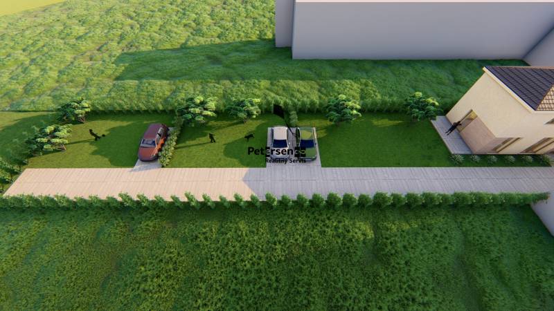 Aerial view of a family house with two cars and a green lawn.