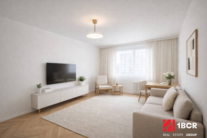 Living room in a studio apartment with wood-patterned flooring, light furniture, and a television.