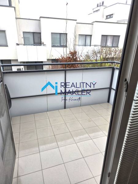 The balcony of a 1-room apartment in Bratislava - Janíkov dvor with a view of neighboring buildings.