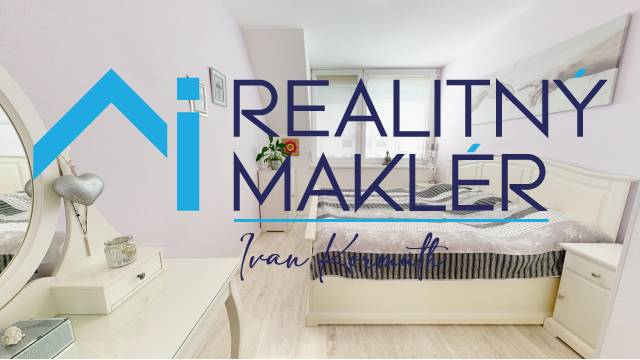 A bedroom in a family house with wood floor decor and light-colored furniture.