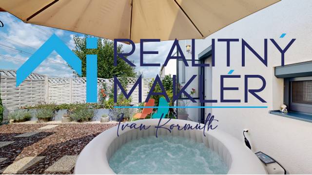 In a family house in Stupava, there is a hot tub with a terrace under a sun umbrella.