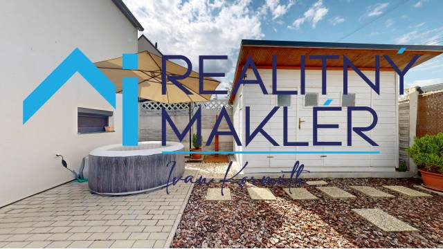 A family house in Stupava with a terrace, hot tub, and pebble garden.