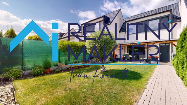 A family house in Stupava with a landscaped garden, walkway, and terrace.