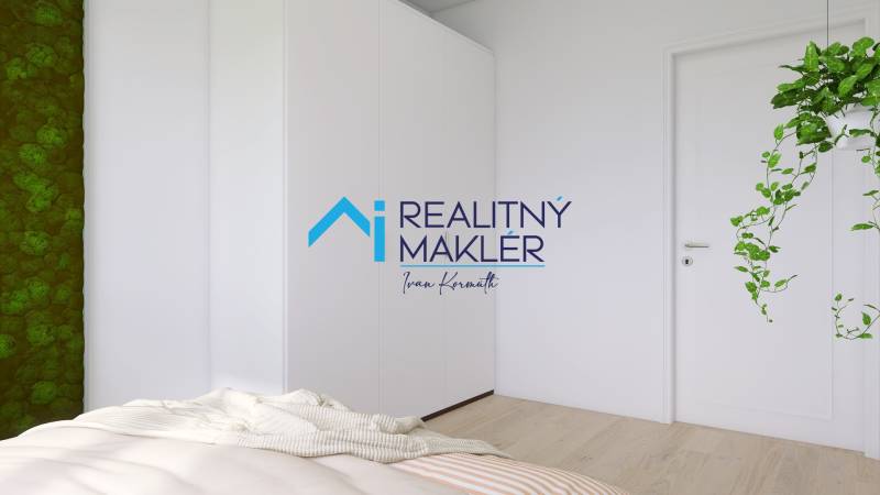 A bedroom with a white wardrobe, a green wall, and plants in a three-room apartment.