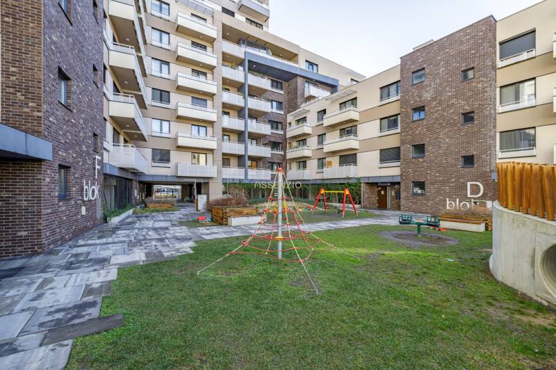 The courtyard of the apartment complex with a children's playground on Na križovatkách Street, Bratislava - Ružinov.