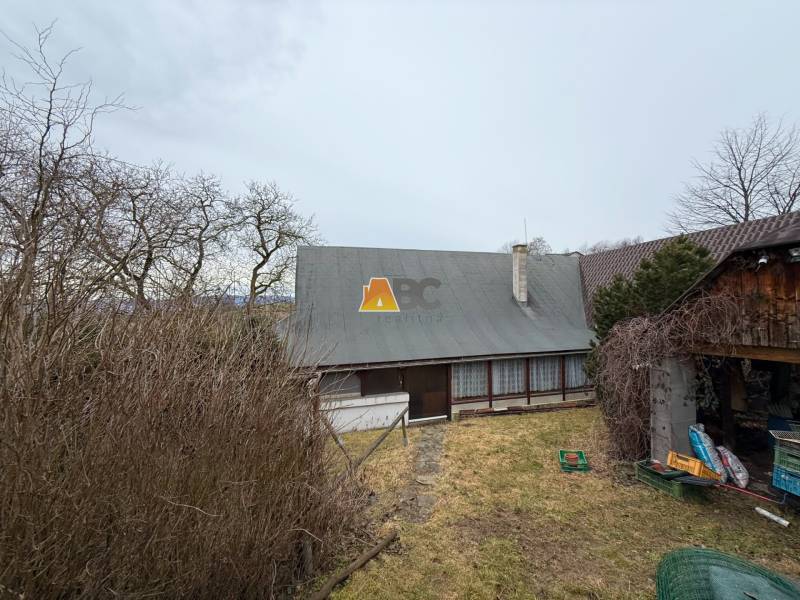 A cottage on Zánemecká Street in Hriňová, surrounded by trees and a garden.