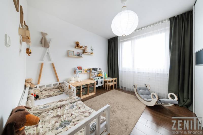 Children's room in a 3-room apartment with toys and a bed, floor with wooden decor.
