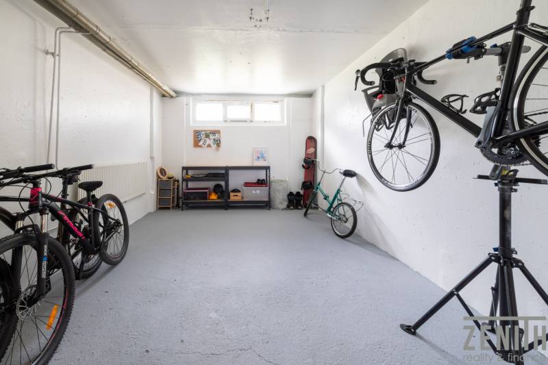 Storage space with bicycles and shelves in a 3-room apartment.