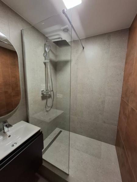 Bathroom in a 5 or more room apartment with a modern shower and sink.