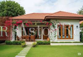 A family house in Liptovský Mikuláš with a lawn and a terrace, decorated with climbing plants.
