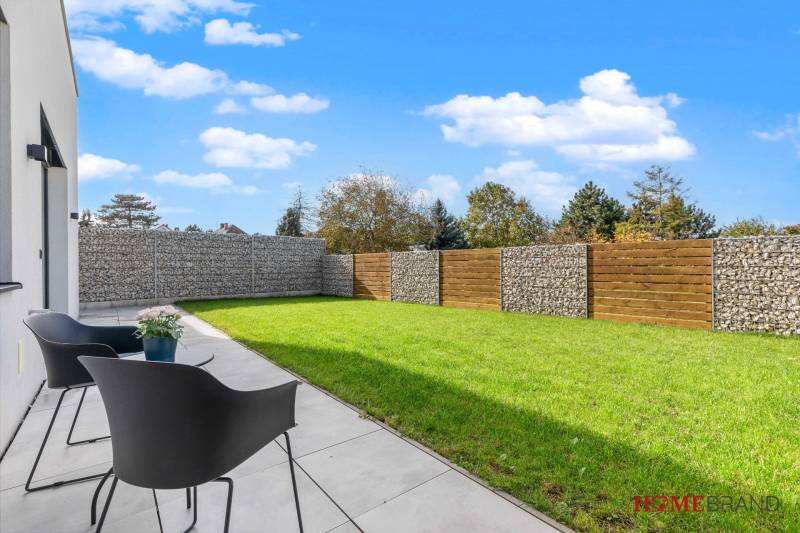 A garden at a 3-room apartment on Lipnicka Street in Dunajska Luzna, with modern fencing.