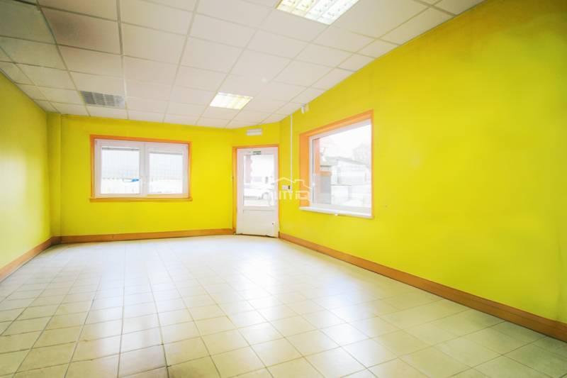 Production premises with bright yellow walls and white tiles.
