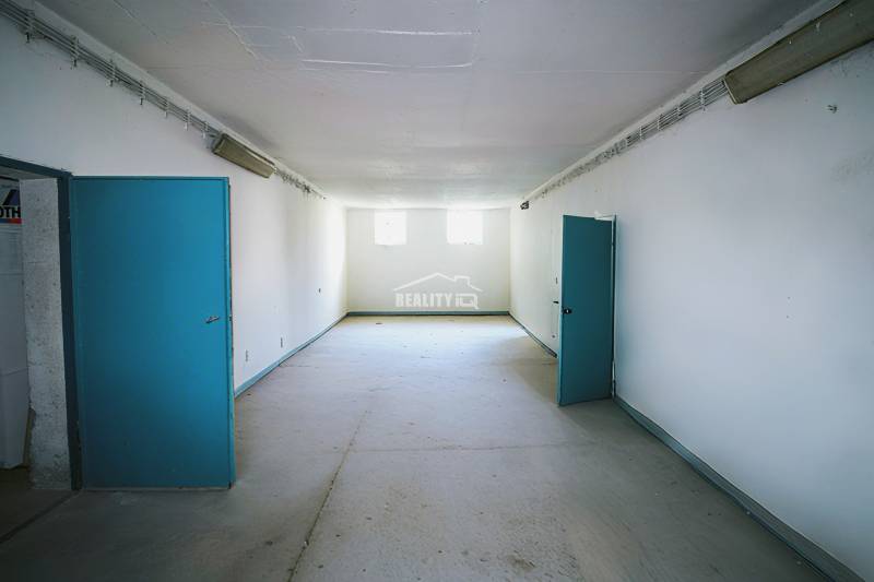 Production premises with blue doors and white walls, bright room.