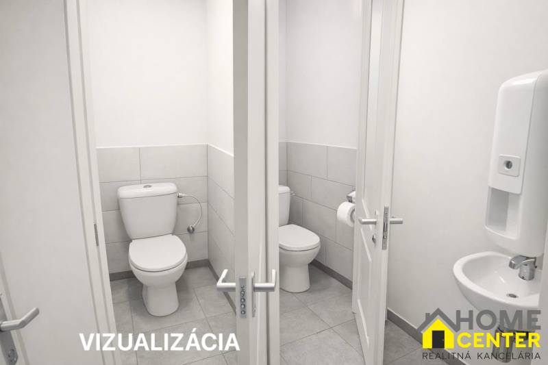 Toilets with white walls and fixtures in catering spaces.