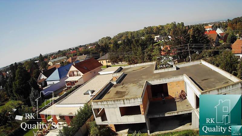 A residential area with family houses in Kráľová pri Senci - Záhumenská, Senec, with greenery and a built-up plot.