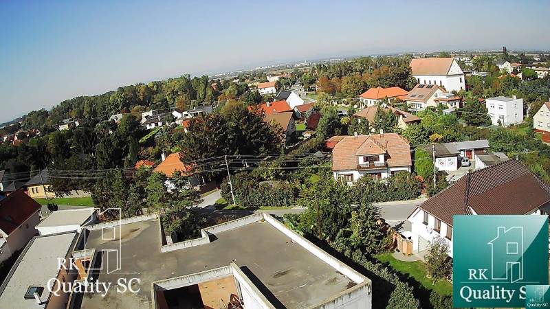 A view of a family house in Kráľová pri Senci on Záhumenská Street with surrounding greenery.