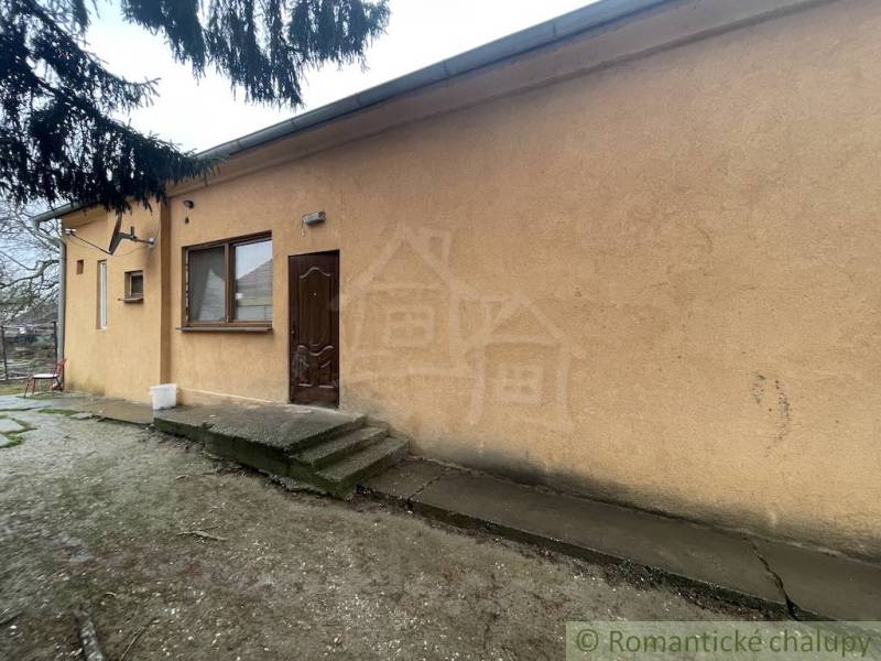 A family house in Neded with an external entrance and a simple facade.