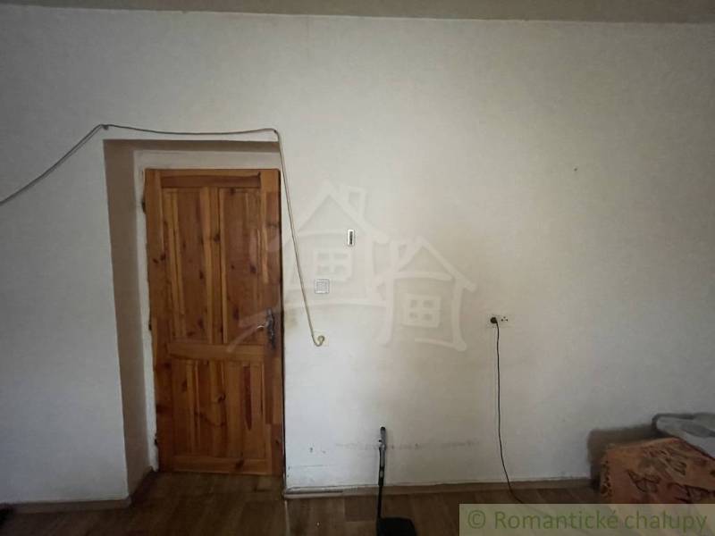 Wooden doors in the interior of a family house with a floor featuring a wood decor.