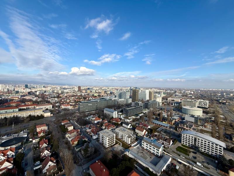 A view of the Bratislava skyline in the Old Town area with high-rise buildings and houses.