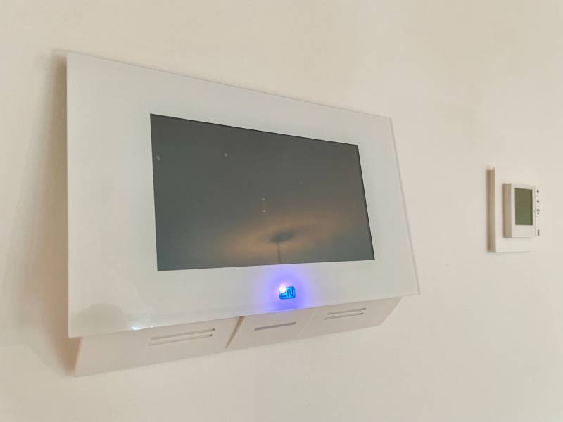 Display with a blue indicator and control panel in a 2-room apartment.
