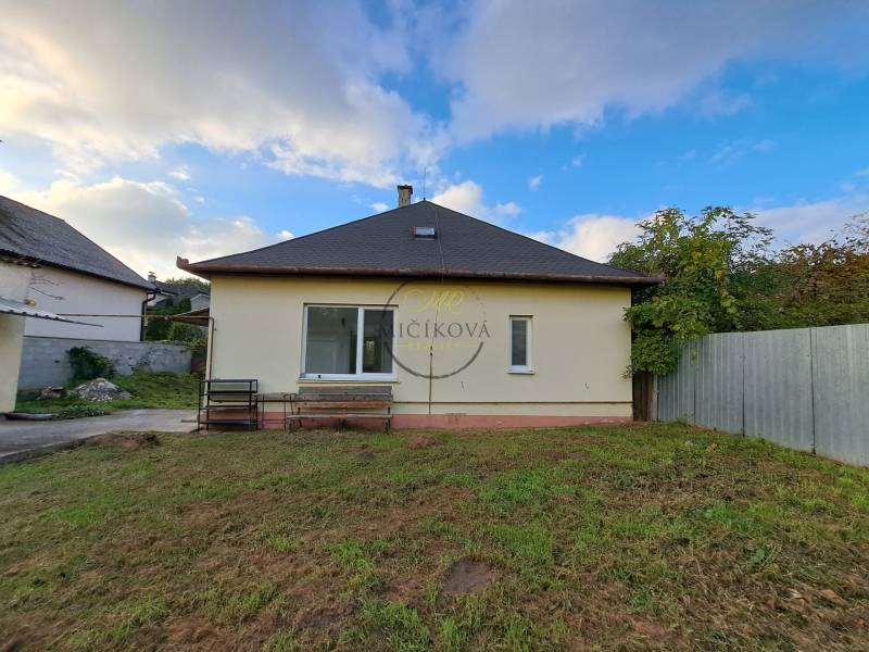 A family house on Mechenická Street in Podhorany, with a garden and a garage.