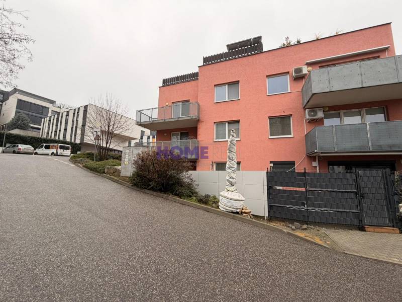 Pink building with iron balconies on Na Zlatej nohe Street, Bratislava - Nové Mesto.