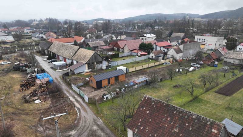 Rural scenery and gardens in Kláštor pod Znievom, with visible rooftops of houses and trees.