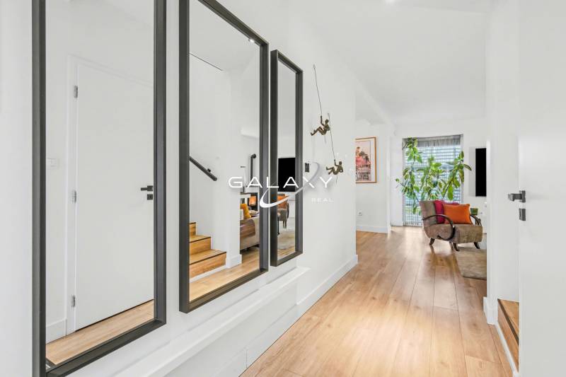 Cozy interior of a family house with a wood-decor floor and decorations.