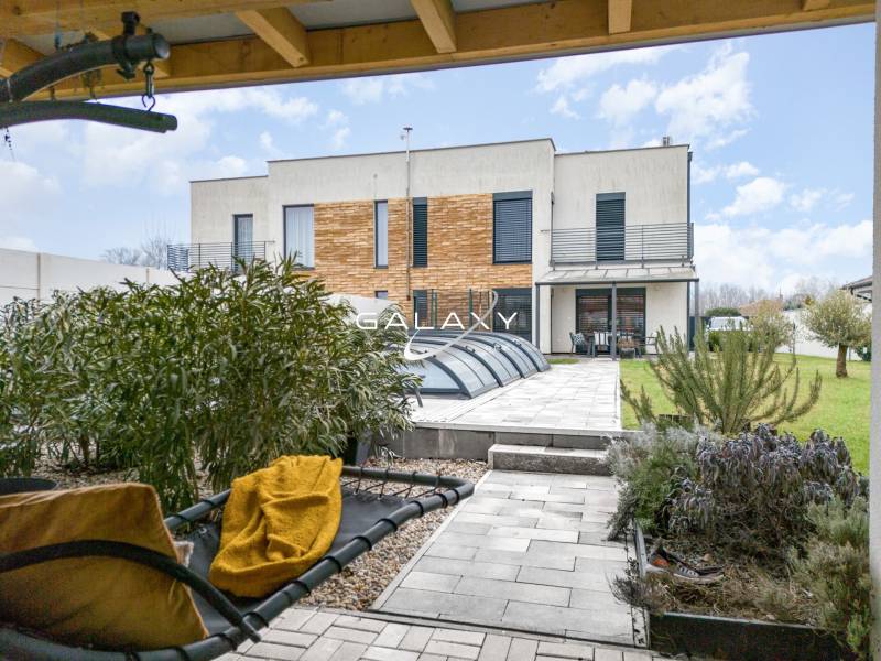 Two-story family house in Dunajský Klátov, garden, terrace, pool cover.