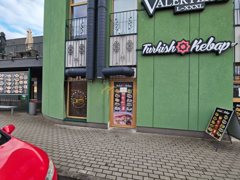 Obchodná Street in Michalovce, dining premises with the sign Turkish Kebap on a green building.