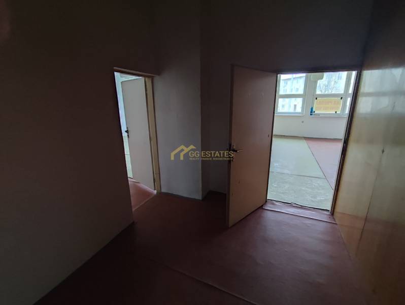 Offices with two open doors and a view of the outside environment.