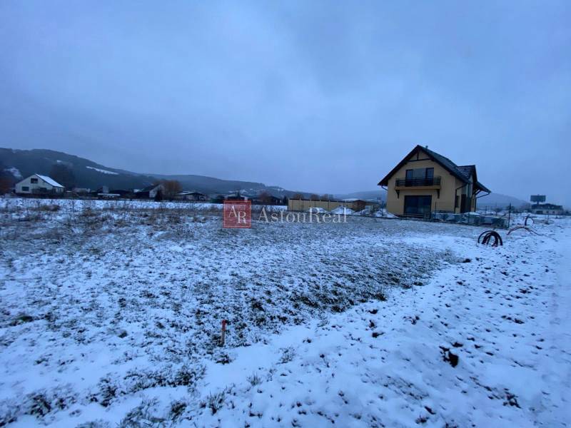 Snow-covered landscape on plots in Trenčín on Poľnohospodárska Street suitable for living.