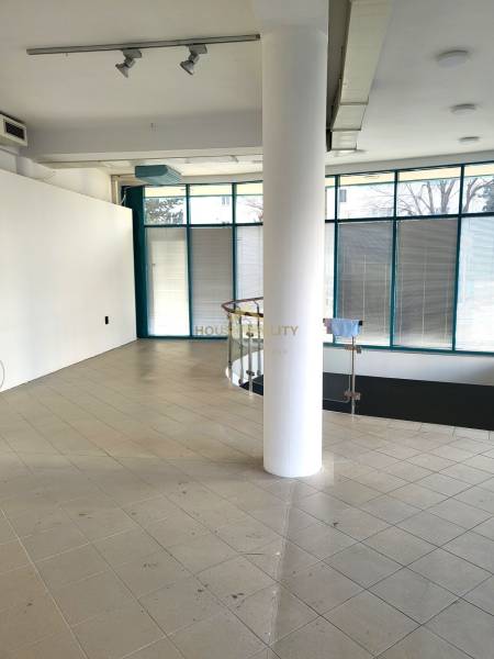 Commercial premises with ceramic tiles, glass walls, and spiral stairs.