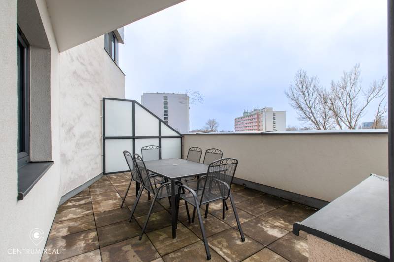 Terrace with garden furniture in a 2-room apartment, view of the apartment buildings Bratislava - Vajnory, Rybničná.