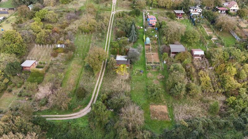 Aerial view of cottages around Hlohovec with surrounding gardens and trees.