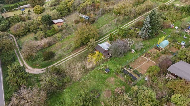 An aerial view of cottages surrounded by gardens and greenery in Hlohovec.
