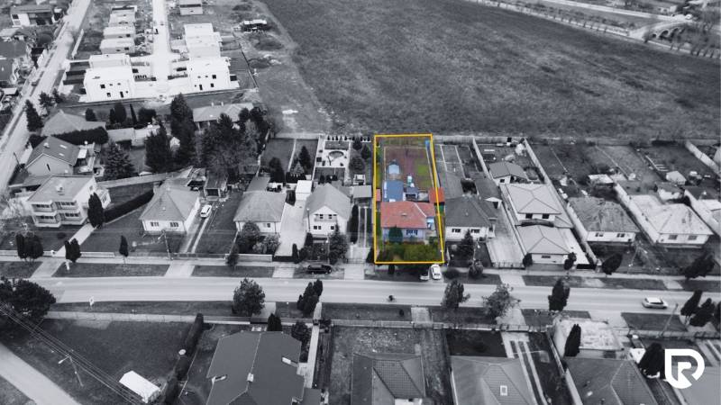 Aerial view of houses and properties on Hlavná Street in Kráľová pri Senci.