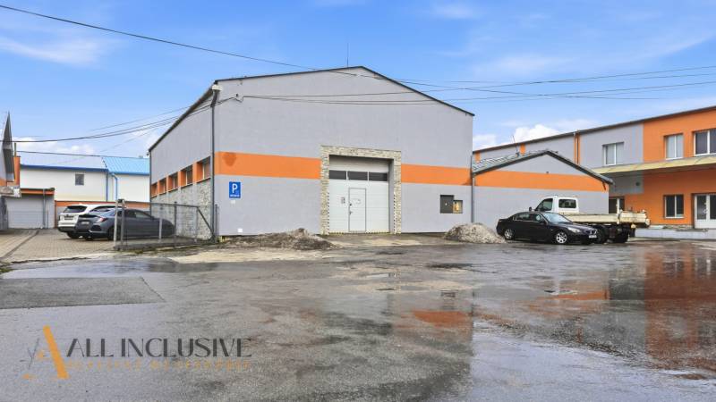 Commercial premises on Pod kalváriou Street in Topoľčany with parking and loading gates.