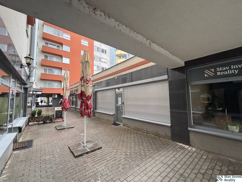 Commercial premises on Lichnerova Street in Senec with outdoor terraces and interlocking paving.