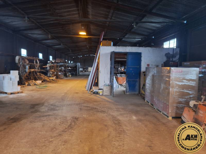Interior of the warehouse with stored materials and equipment on Lieskovská cesta in Zvolen.