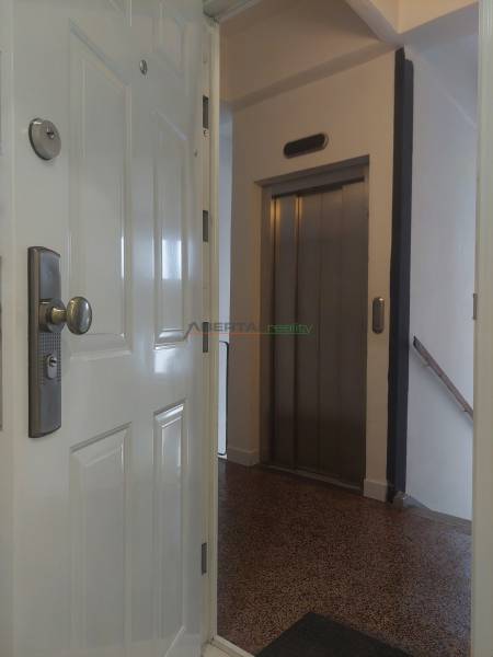 2-bedroom apartment with a view of the elevator and entrance doors.