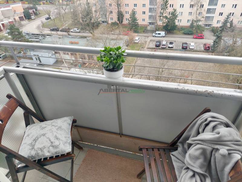 Balcony of a 2-room apartment with a view of the parking lot and greenery, Šalviová, Bratislava - Ružinov.