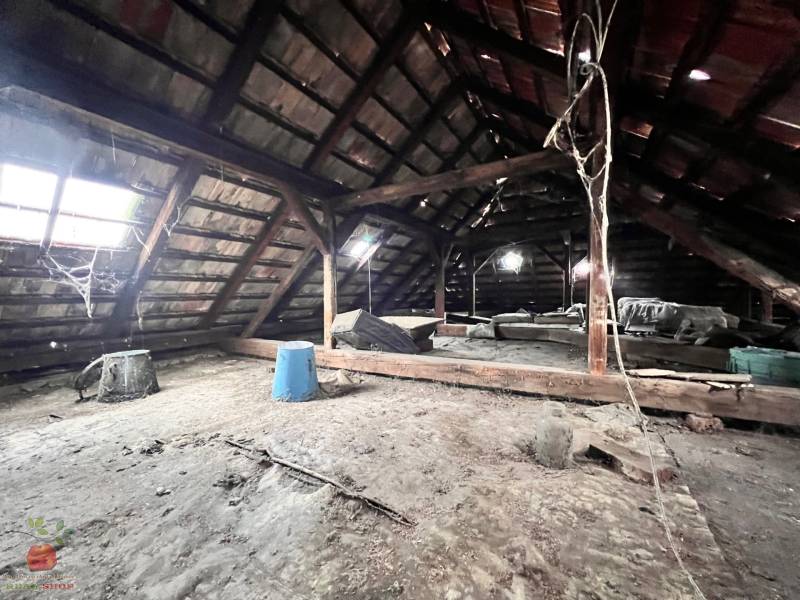 The attic of a family house with a wooden structure and roof windows in Komjatice.