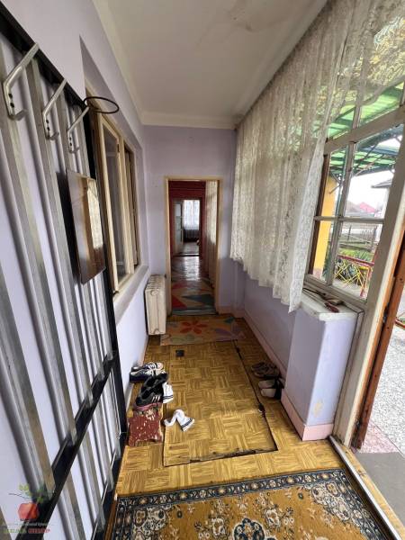Interior of a family house with a wooden decor floor and a row-like space.